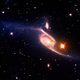 Illustration for article titled NASA says NGC 6872 is the largest spiral galaxy ever discovered